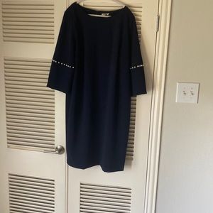 Classy spring dress. Calvin Klein navy dress with pearl bell sleeve detail.18W.